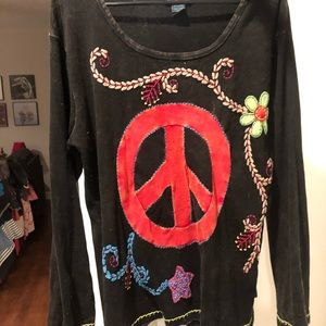 Black appliqué top with red peace sign.